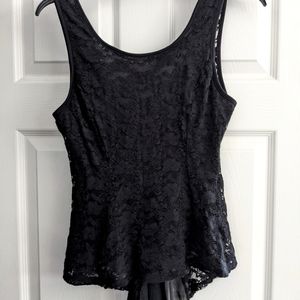 Black women's blouse. Long back with bow.